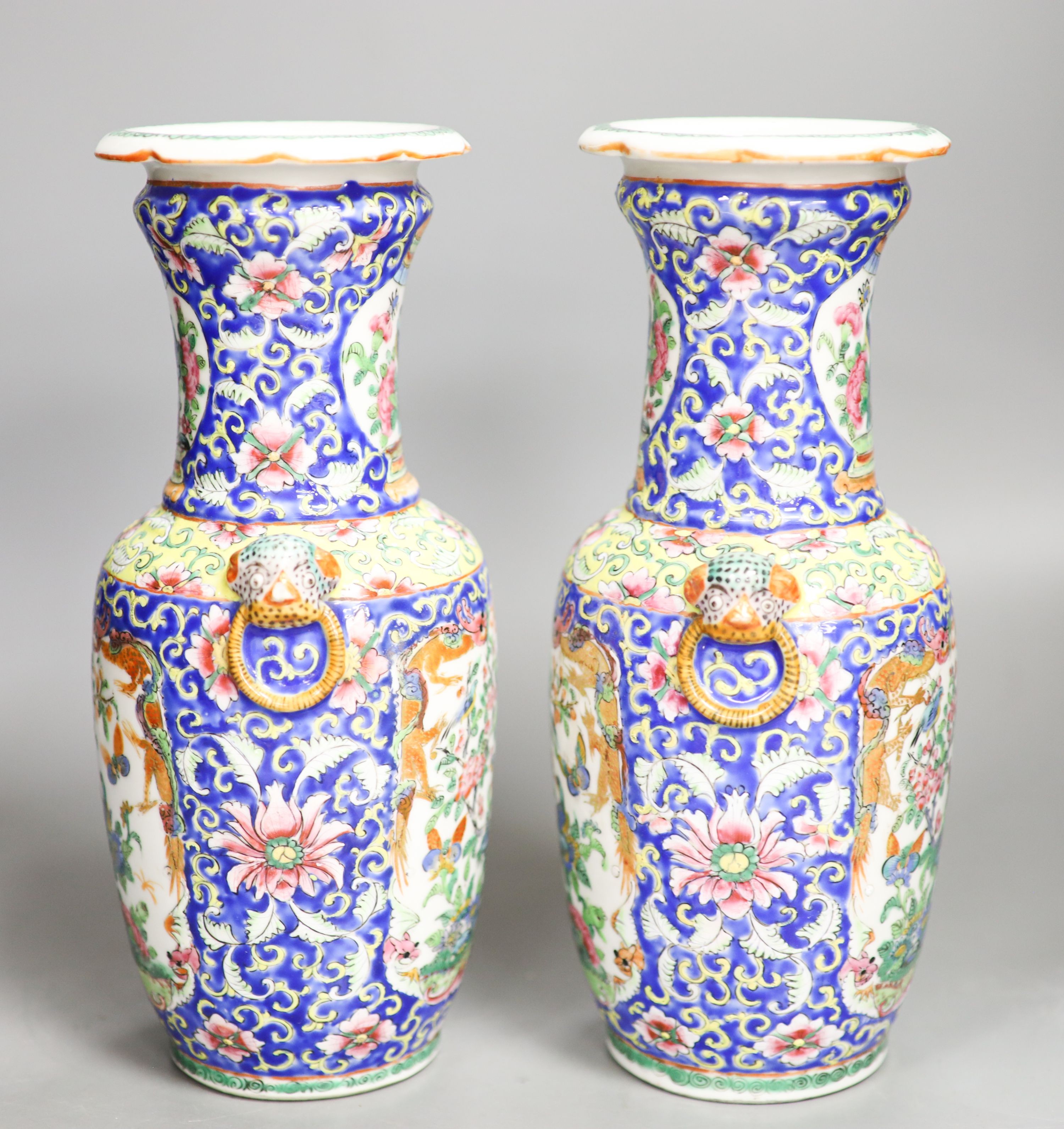 A pair of 19th century Chinese famille rose vases 24.5cm